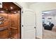 Elevator with wood paneled interior and open door to living room at 238 Trecastle Sq, Canton, GA 30114