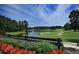 Scenic golf course view with lush greenery and a tranquil pond at 238 Trecastle Sq, Canton, GA 30114