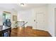 Hallway with beautiful wood floors and laundry area at 238 Trecastle Sq, Canton, GA 30114