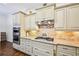 Well-lit kitchen featuring custom cabinets, granite countertops, and stainless steel appliances at 238 Trecastle Sq, Canton, GA 30114