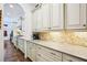 Elegant kitchen with granite counters, tiled backsplash, and lots of storage space at 238 Trecastle Sq, Canton, GA 30114