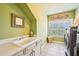 Laundry room with sink, cabinets, and a window for natural light at 238 Trecastle Sq, Canton, GA 30114