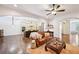 Spacious living room with hardwood floors, open archways, and a comfortable seating area at 238 Trecastle Sq, Canton, GA 30114