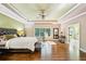 Bright main bedroom with hardwood floors and large windows at 238 Trecastle Sq, Canton, GA 30114