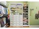 Walk-in closet with custom built-in shelving and drawers for organization at 238 Trecastle Sq, Canton, GA 30114
