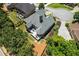 Aerial view showcasing the home's backyard, deck, landscaping, and neighborhood at 4251 Lantern Hill Dr, Dacula, GA 30019