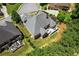 Overhead view showing the home's backyard, spacious deck, mature trees, and surrounding neighborhood at 4251 Lantern Hill Dr, Dacula, GA 30019