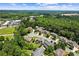 Expansive aerial view of the property, displaying its prime location near shopping and surrounded by mature trees at 4251 Lantern Hill Dr, Dacula, GA 30019