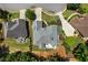 Overhead view of the house, showcasing its expansive roofline and well-maintained backyard, with privacy provided by mature trees at 4251 Lantern Hill Dr, Dacula, GA 30019