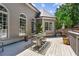 Inviting back deck with dining table, sitting area, and peaceful outdoor setting at 4251 Lantern Hill Dr, Dacula, GA 30019