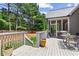 Backyard deck with view of screened porch and wooded area at 4251 Lantern Hill Dr, Dacula, GA 30019