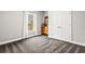 The bedroom features a window, gray walls, light colored carpet, and double door closet at 4251 Lantern Hill Dr, Dacula, GA 30019