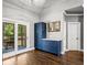 Breakfast nook features a blue cabinet and sliding glass doors to the back patio at 4251 Lantern Hill Dr, Dacula, GA 30019