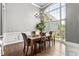 Dining room with large windows, hardwood floors, stylish chandelier at 4251 Lantern Hill Dr, Dacula, GA 30019