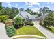 Charming home exterior with well-manicured lawn, lush landscaping, and inviting curb appeal at 4251 Lantern Hill Dr, Dacula, GA 30019