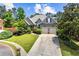 Inviting single Gathering home featuring a manicured lawn, charming curb appeal, and a 2-car garage at 4251 Lantern Hill Dr, Dacula, GA 30019