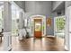 Grand foyer featuring soaring ceilings, hardwood floors, and ample natural light at 4251 Lantern Hill Dr, Dacula, GA 30019