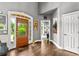 Welcoming foyer featuring hardwood floors, stylish decor, and an arched doorway at 4251 Lantern Hill Dr, Dacula, GA 30019