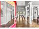 Spacious foyer featuring hardwood floors, soaring ceilings, and decorative columns at 4251 Lantern Hill Dr, Dacula, GA 30019