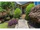 Inviting front entrance featuring well manicured landscaping, colorful plants and inviting steps at 4251 Lantern Hill Dr, Dacula, GA 30019