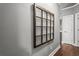 Neutral hallway featuring hardwood floors, white doors and window frame wall decoration at 4251 Lantern Hill Dr, Dacula, GA 30019