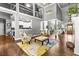 Spacious living room with a view to the kitchen, entry, and dining room at 4251 Lantern Hill Dr, Dacula, GA 30019