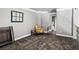 View of loft area featuring a cozy chair and large window, perfect for relaxation and enjoying natural light at 4251 Lantern Hill Dr, Dacula, GA 30019