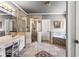 Bathroom featuring tiled shower, soaking tub, vanity and decorative tiled floors at 4251 Lantern Hill Dr, Dacula, GA 30019