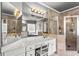 Main bathroom with a double vanity, tiled shower, and separate soaking tub at 4251 Lantern Hill Dr, Dacula, GA 30019