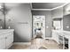 Spacious bathroom featuring vanity, tiled floors and doorway to main bedroom at 4251 Lantern Hill Dr, Dacula, GA 30019