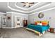 Comfortable main bedroom with gray walls, carpet, and doorway to main bathroom at 4251 Lantern Hill Dr, Dacula, GA 30019