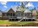 The rear exterior features a large deck and screened-in porch, ideal for relaxing and enjoying the outdoors at 4251 Lantern Hill Dr, Dacula, GA 30019
