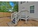 Backyard featuring access door, privacy fence, and a small deck with stairs to ground at 786 Neal Nw St, Atlanta, GA 30318