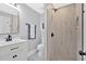 Modern bathroom features a walk-in shower, stylish vanity, and contemporary fixtures at 786 Neal Nw St, Atlanta, GA 30318