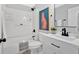 Charming bathroom with stylish vanity, shower/tub combo, and eye-catching cheetah print artwork at 786 Neal Nw St, Atlanta, GA 30318