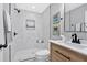 Bathroom featuring marble tile shower, modern vanity, and sleek black fixtures at 786 Neal Nw St, Atlanta, GA 30318