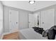 Bedroom with multiple doors, hardwood floors, and neutral paint at 786 Neal Nw St, Atlanta, GA 30318