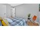 Clean bedroom featuring hardwood floors and chair with orange pillows for a pop of color at 786 Neal Nw St, Atlanta, GA 30318
