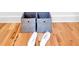 Close up of decor, featuring wooden floors and matching flip flops and storage boxes at 786 Neal Nw St, Atlanta, GA 30318