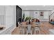 Open-concept dining area boasts hardwood floors, a modern fireplace, and access to the living room at 786 Neal Nw St, Atlanta, GA 30318