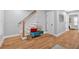 Entryway with hardwood floors, stairs, and cozy bench at 786 Neal Nw St, Atlanta, GA 30318