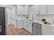 Modern kitchen featuring white cabinetry, stainless steel appliances, and sleek countertops at 786 Neal Nw St, Atlanta, GA 30318