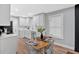 Bright kitchen with white cabinets, stainless steel appliances, and a dining table at 786 Neal Nw St, Atlanta, GA 30318