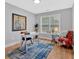 Office space featuring hardwood floors, natural light, stylish chair, and large accent rug at 786 Neal Nw St, Atlanta, GA 30318