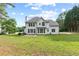 Two-story home with a spacious backyard, patio area, and ample natural light at 9307 Glenleigh Way, Jonesboro, GA 30236
