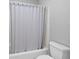 Bathroom featuring a standard tub and shower combination with a neutral-colored shower curtain at 9307 Glenleigh Way, Jonesboro, GA 30236