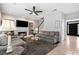 Inviting living room featuring a fireplace, built-ins, and lots of natural light at 9307 Glenleigh Way, Jonesboro, GA 30236