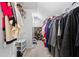 Large walk-in closet, well organized, providing ample storage with shelving and hanging space at 9307 Glenleigh Way, Jonesboro, GA 30236