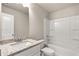Bathroom featuring a granite countertop, vanity, soaking tub, and shower at 181 Dewy Rd # 70, Lilburn, GA 30047