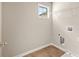 Bright laundry room with window, shelving and tiled floor at 181 Dewy Rd # 70, Lilburn, GA 30047